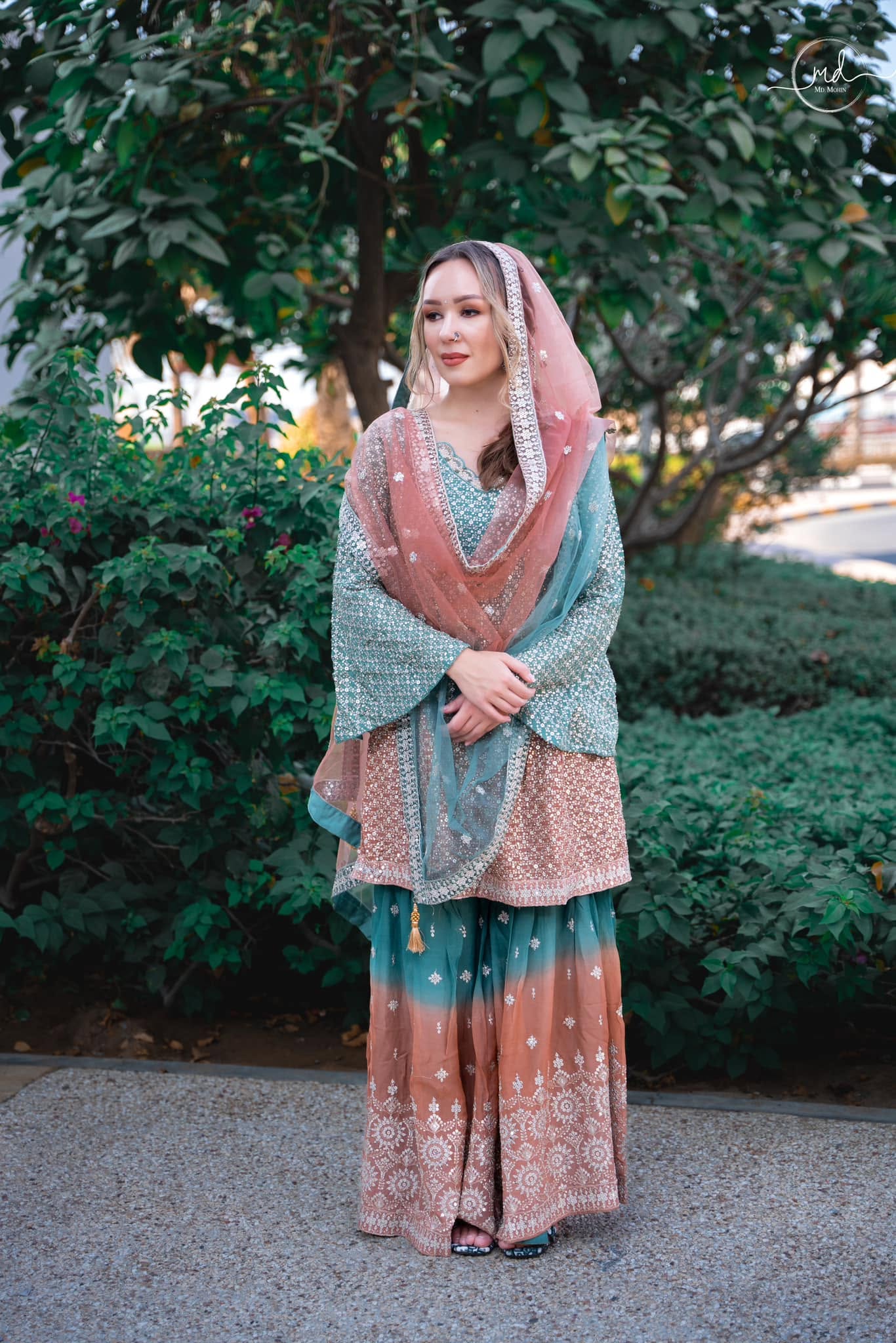 Mint and rose occasionwear with intricate embellishment and a delicate draped scarf